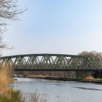 A train bridge over a river in the Netherlands going over the Wilhelminakanaal