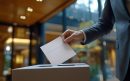 vecteezy_a-man-casting-his-vote-in-an-urban-polling-station-during_53210194-min-aspect-ratio-800-500